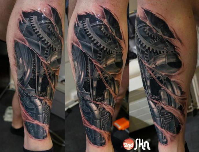 tatouage biomecanique mollet