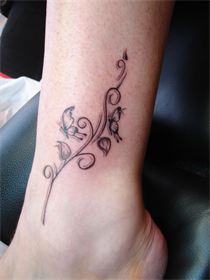 tatouage cheville tribal papillon