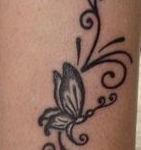 tatouage cheville tribal papillon