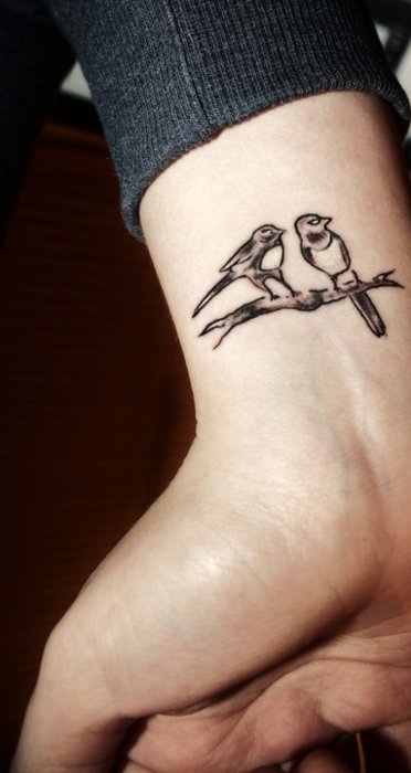 tatouage oiseaux sur une branche