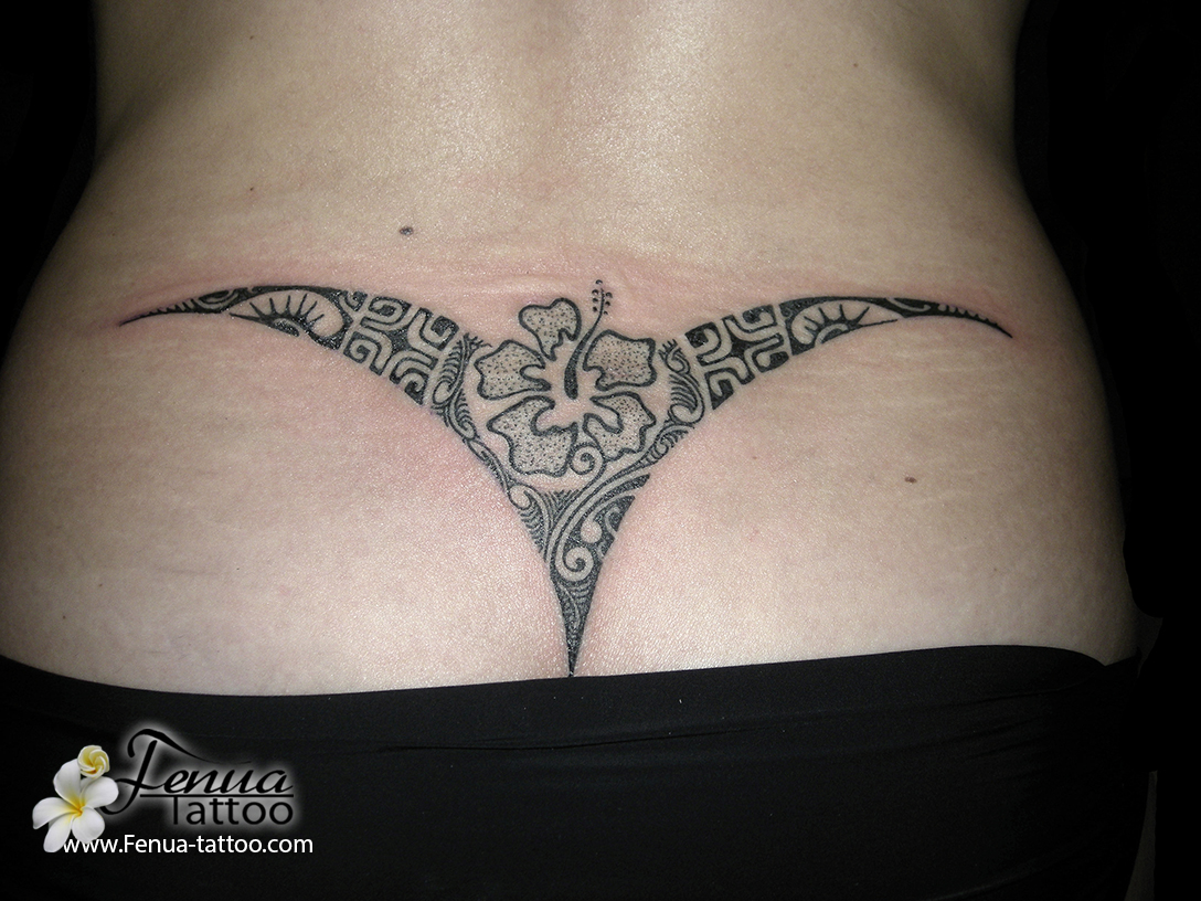 tatouage polynésien femme bas du dos